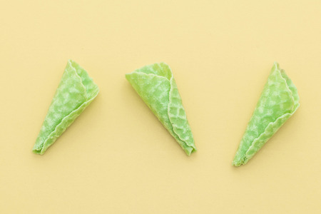 green tea wafer cone on yellow backgroundの写真素材