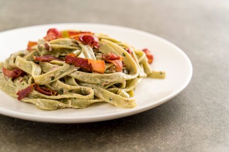 spinach fettuccini pasta with bacon - Italian food styleの写真素材