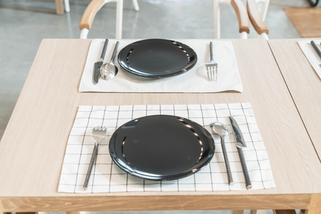 empty plate on dinning tableの写真素材