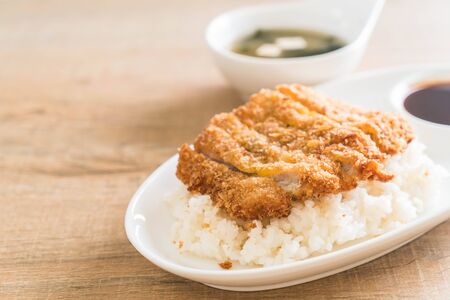 fried pork on topped rice (tonkatsu) with miso soup - japanese food styleの写真素材