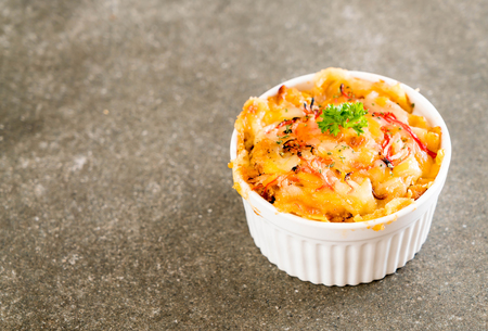 macaroni baked with cheese and crab stick on tableの写真素材