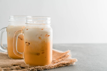 iced thai milk tea in glassの写真素材