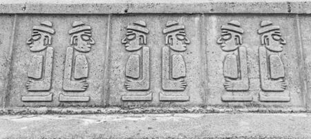 Dol hareubangs statues on wall in Jeju Island, South Koreaのeditorial素材