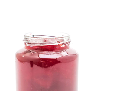 strawberry jam in jar isolated on white backgroundの写真素材