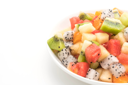 mix sliced fruits (orange, dragon fruit, watermelon, pineapple, kiwi) isolated on white backgroundの写真素材