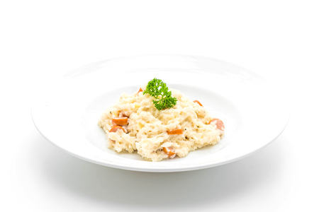risotto with sausage isolated on white backgroundの写真素材