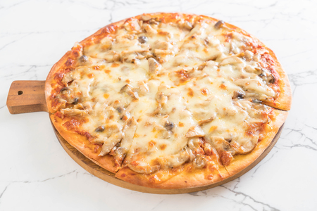 mushroom pizza with miso sauce on tableの写真素材