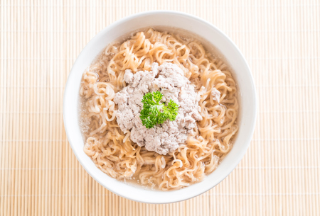 instant noodles with mince pork on the tableの写真素材