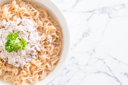 instant noodles with mince pork on the tableの写真素材
