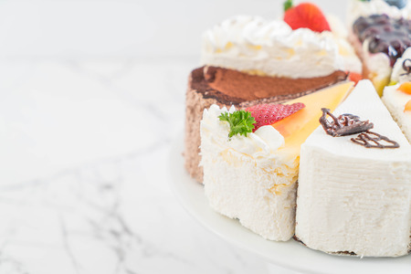 different pieces of cake on cake standの写真素材