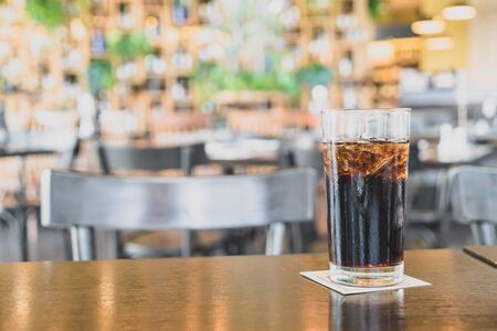 a glass of iced cola in restaurant