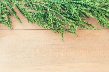 christmas tree with christmas decoration on wood background - vintage effect filter