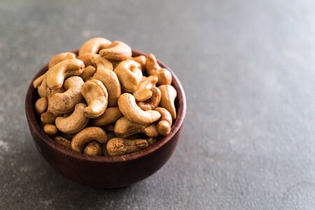 Roasted cashew nuts in bowlの写真素材