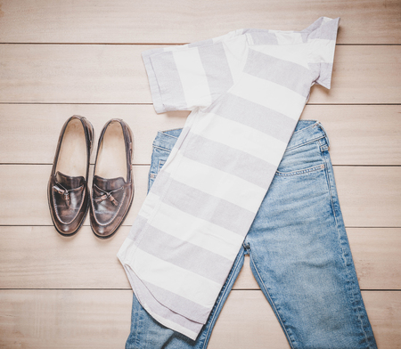 Clothing for men on the wooden background - vintage effect filterの写真素材