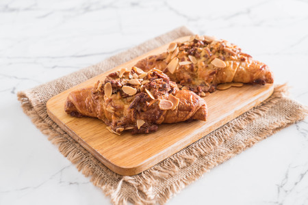 fresh baked croissant with almondsの写真素材