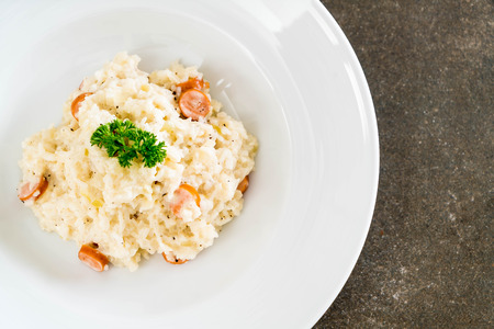 risotto with sausage on the tableの写真素材