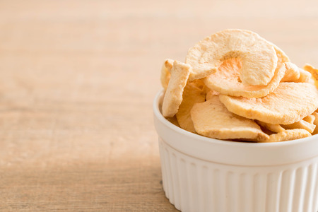 dried apple chips in bowlの写真素材