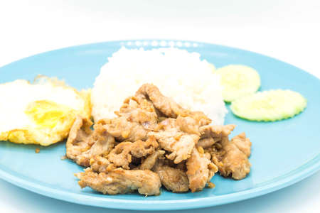 Fried Pork with Garlic Pepper and Fried egg on Rice - Asian food styleの写真素材