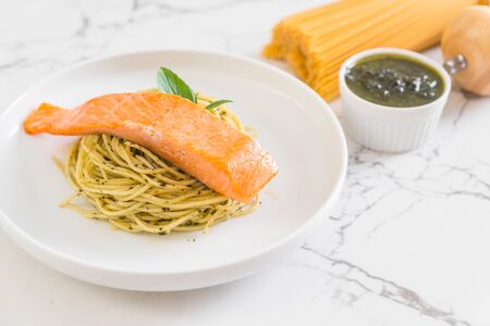 pasta spaghetti with pesto green and salmon - Italian food styleの写真素材