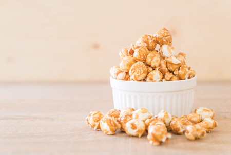 popcorn with caramel in bowlの写真素材