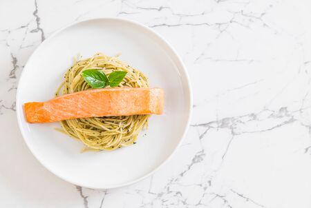 pasta spaghetti with pesto green and salmon - Italian food styleの写真素材