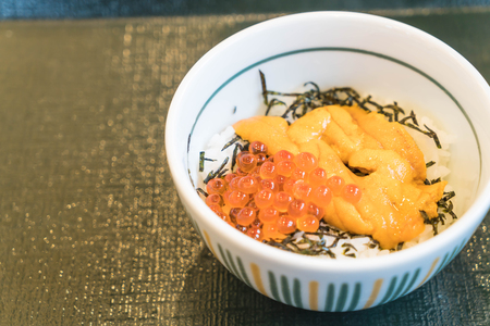 Ikura and Uni Don (salmon roe and urchin eggs topping on Japanese rice ) - japanese food styleの写真素材