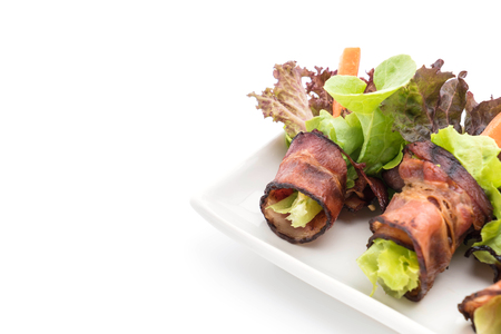 salad roll with bacon on white backgroundの写真素材