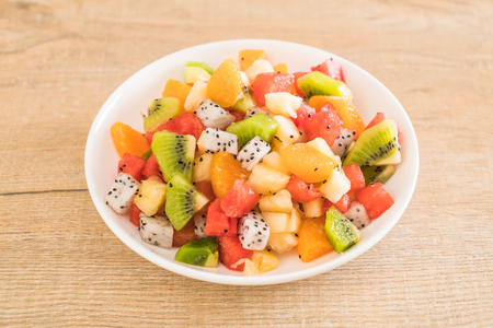 mix sliced fruits (orange, dragon fruit, watermelon, pineapple, kiwi)の写真素材