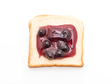 bread with blueberry jam isolated on white backgroundの写真素材