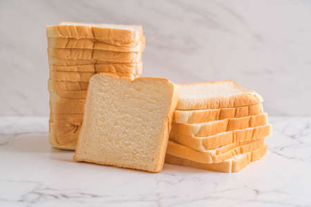 sliced bread stack on tableの写真素材
