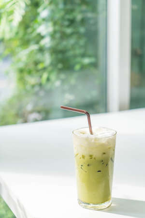 iced green tea with milk  in cafeの写真素材