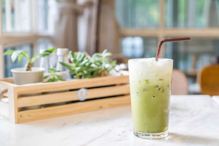 iced green tea with milk  in cafeの写真素材