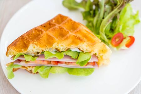waffle ham cheese sandwich with vegetablesの写真素材