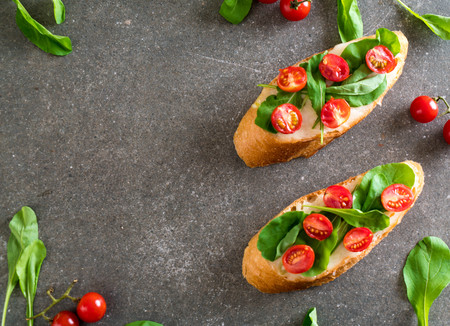 bread with rocket and tomatoes - healthy or vegan food styleの写真素材