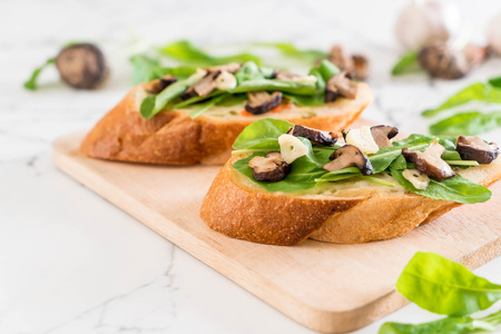 bread with rocket and shiitake mushroom - healthy or vegan food styleの写真素材