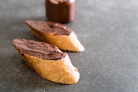 bread with chocolate hazelnut spread on table