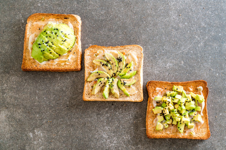 wholewheat bread toast with avocado - vegan or healthy food styleの写真素材