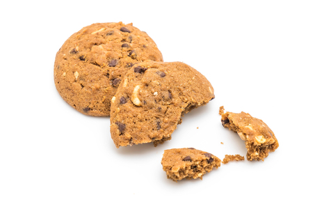 chocolate chips and cashew nut cookies isolated on white backgroundの写真素材