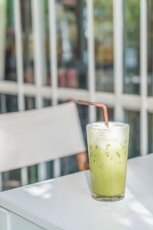 iced green tea with milk  in cafeの写真素材
