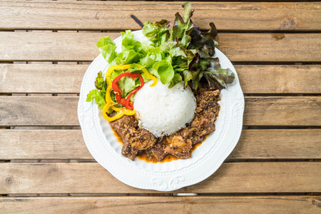 rice with roast rice pork on white plateの写真素材
