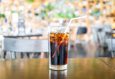 a glass of cola with iceの写真素材