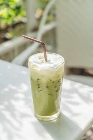 iced green tea with milk  in cafeの写真素材