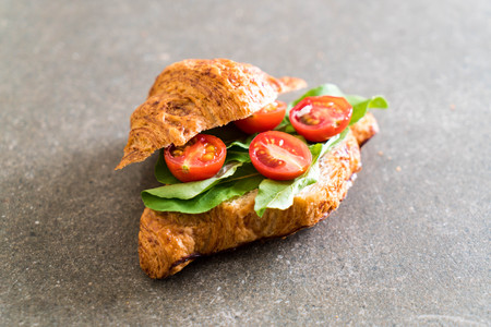 tomatoes croissant sandwich - healthy or vegan food styleの写真素材
