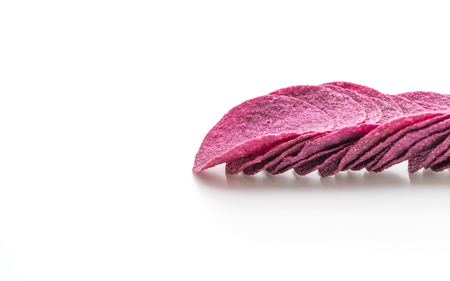 sweet potato chips isolated on white backgroundの写真素材