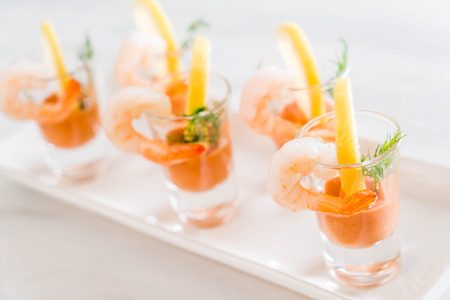 shrimp cocktail with sauce on tableの写真素材