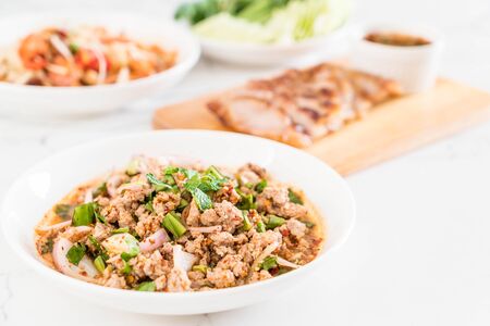 spicy mince pork (Larb - Traditional Thai Food) on the tableの写真素材