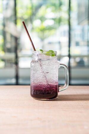 grape fruit soda jar on tableの写真素材