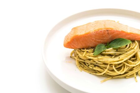 pasta spaghetti with pesto green and salmon isolated on white backgroundの写真素材