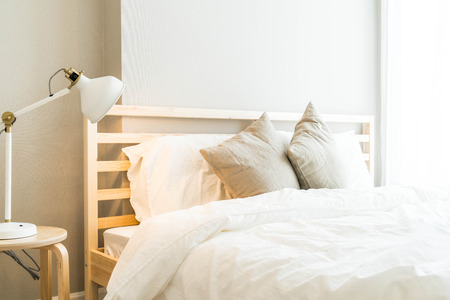 Comfortable Pillow on bed decoration in bedroom interiorの写真素材