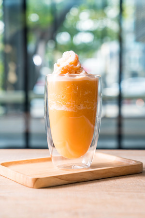 blend thai milk tea milkshake in cafeの写真素材